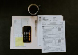 Credit report and car keys representing how credit scores affect car insurance rates