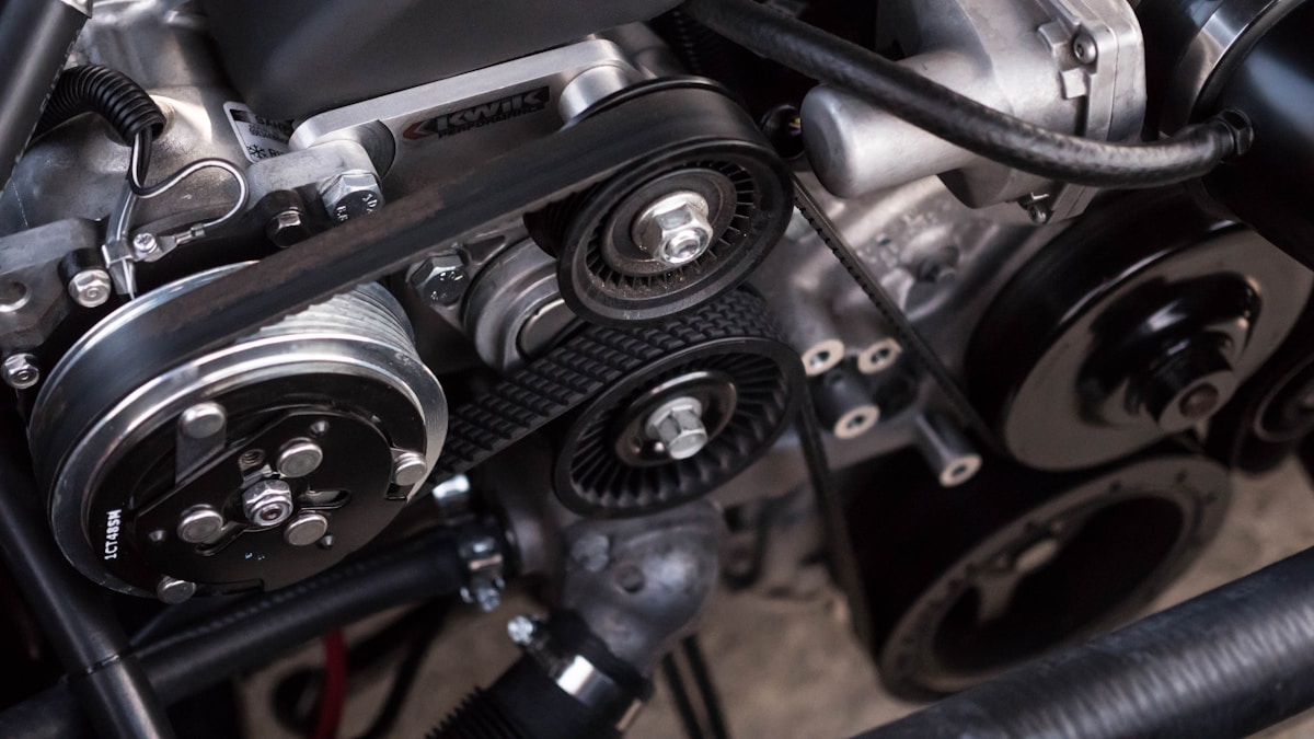 Mechanic inspecting a car engine, illustrating whether car insurance covers a blown engine