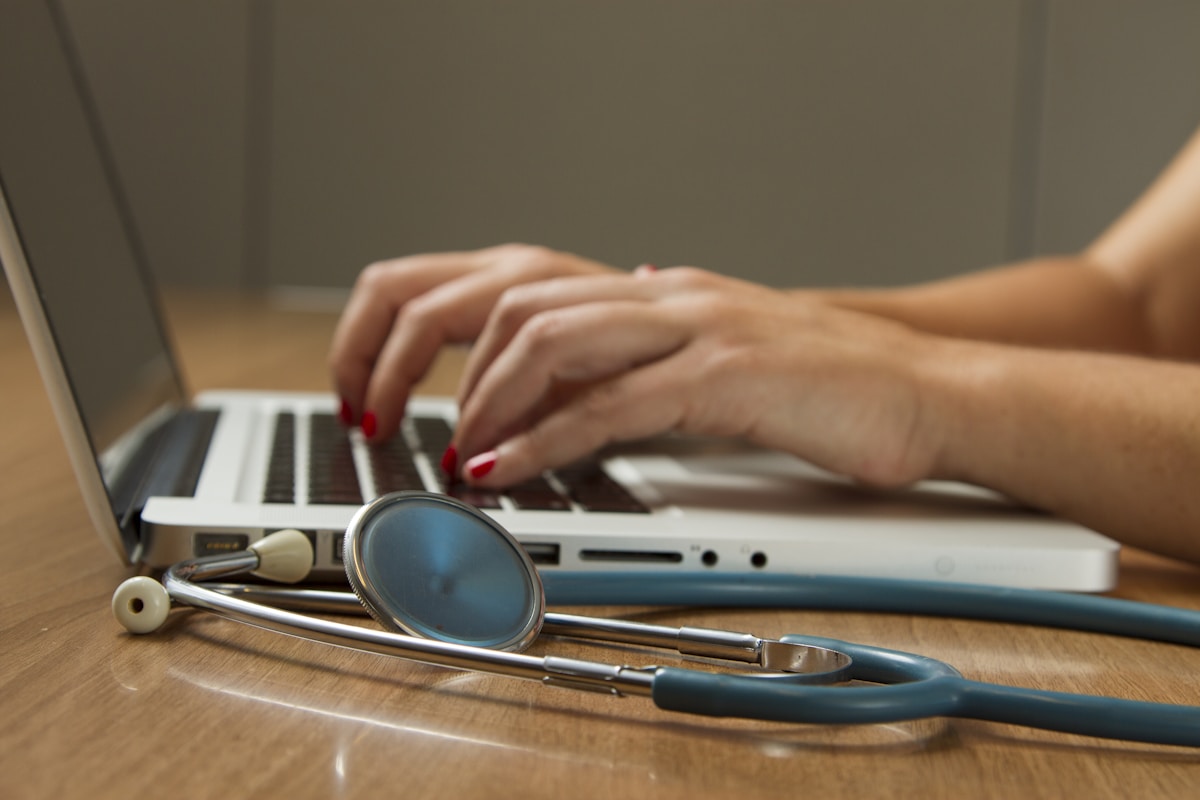 Life insurance medical exam paramedical professional checking blood pressure