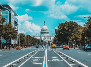 Washington DC car insurance requirements city street with US Capitol building