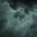 Umbrella sheltering a family home representing umbrella insurance liability protection
