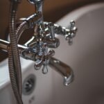 Water leaking from a burst pipe, illustrating homeowners insurance burst pipe coverage