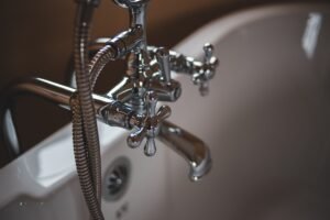 Water leaking from a burst pipe, illustrating homeowners insurance burst pipe coverage